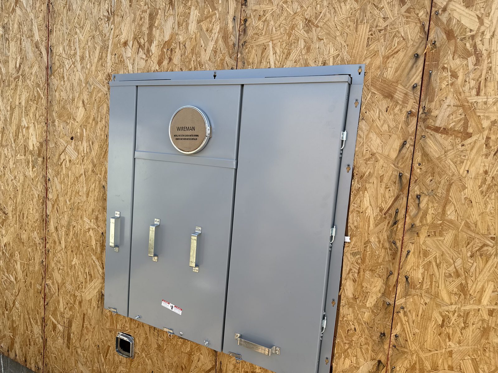 New electrical service panel installed on a new construction project