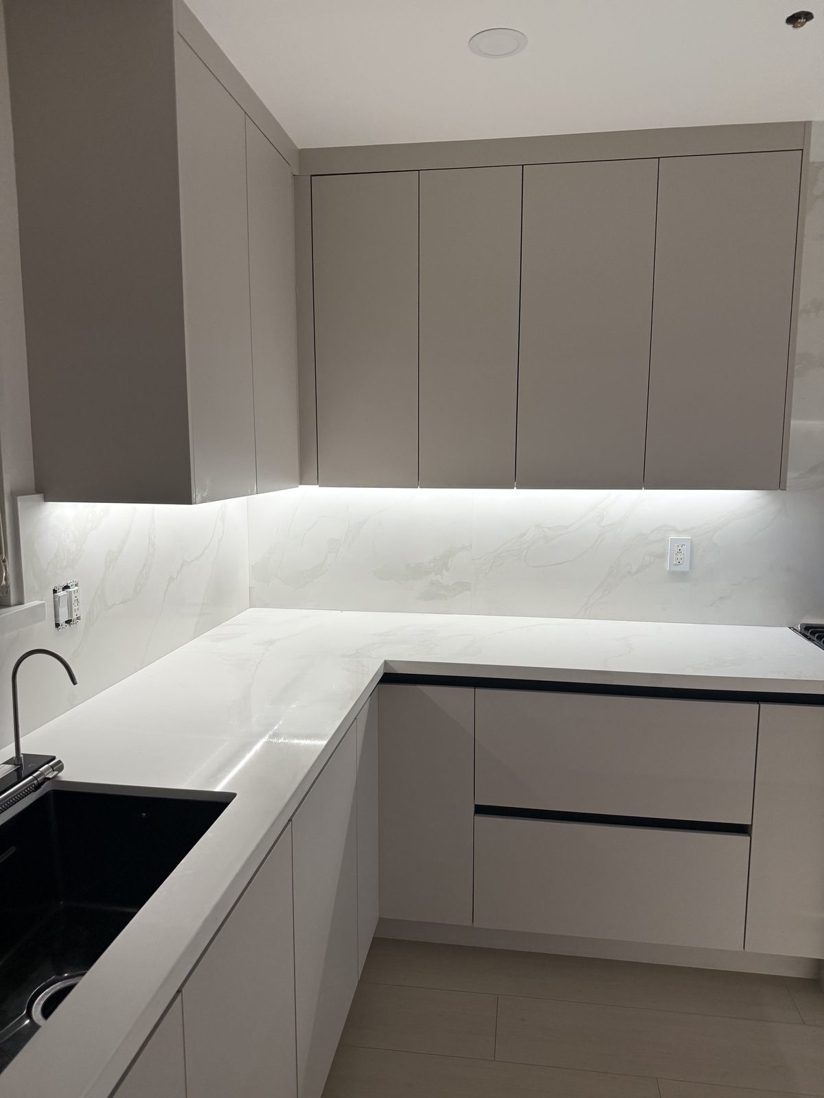 Under-cabinet LED task lighting installed in a modern kitchen remodel